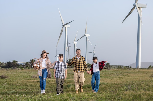 Young couple with children walking in farmland