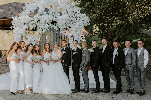 Young couple with the funny friends on the wedding