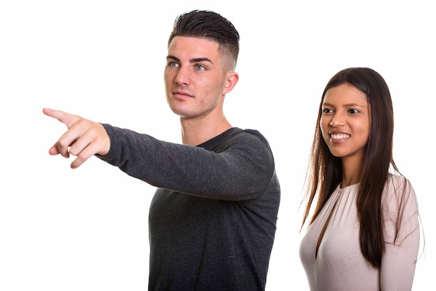 young couple with man pointing finger