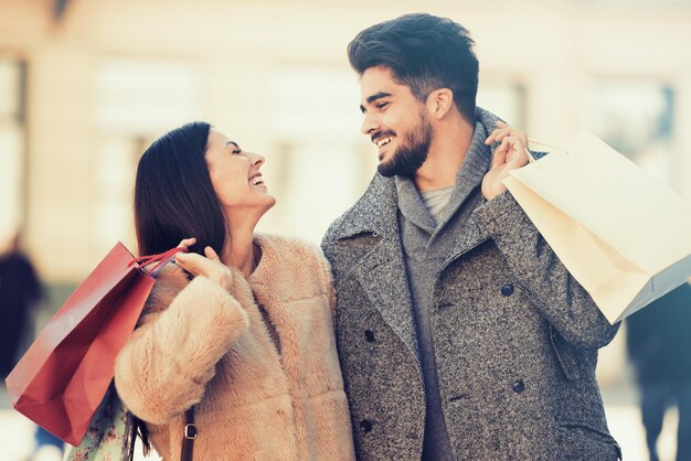 Young couple with shopping bags