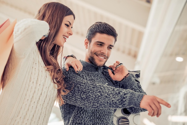 Young couple with shopping bags