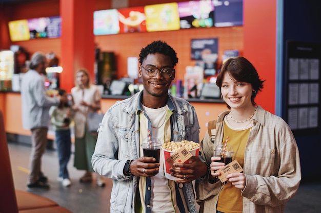 Young couple with tickets for movie