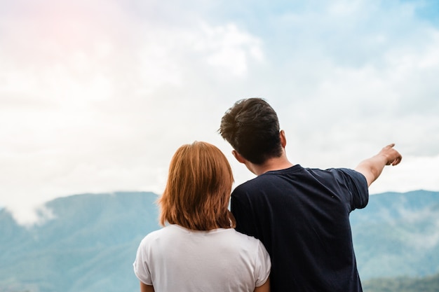 Young couples hugging the sunset evening