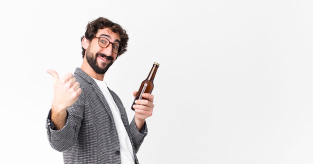 Young crazy bearded businessman having a beer