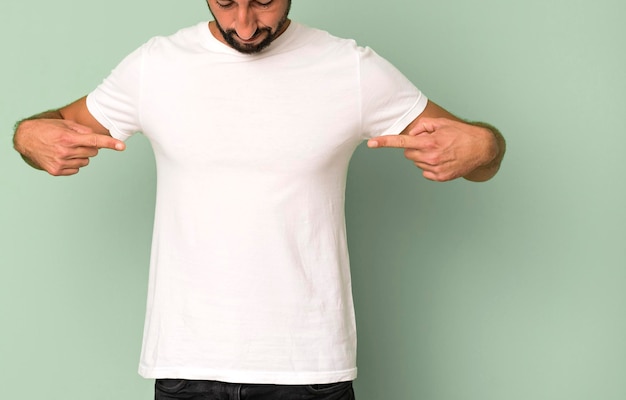 Young crazy bearded and expressive man wearung an empty blank t shirt mock up