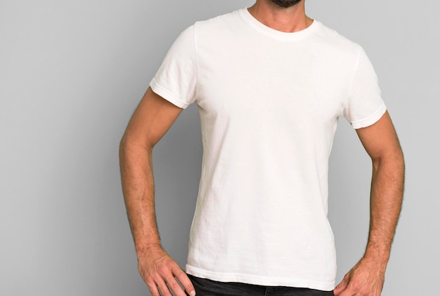 Young crazy bearded and expressive man wearung an empty blank t\
shirt mock up