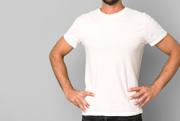 Young crazy bearded and expressive man wearung an empty blank t\
shirt mock up