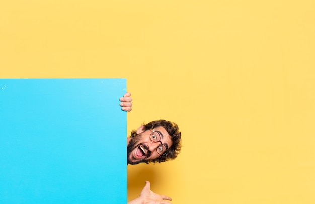 Young crazy bearded man expressing a emotion