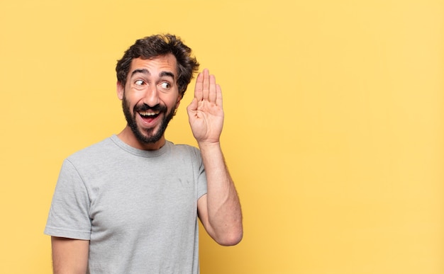 Young crazy bearded man surprised expression