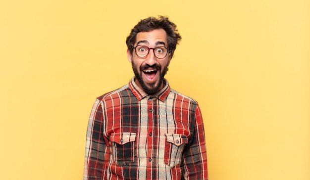 Young crazy bearded man surprised expression