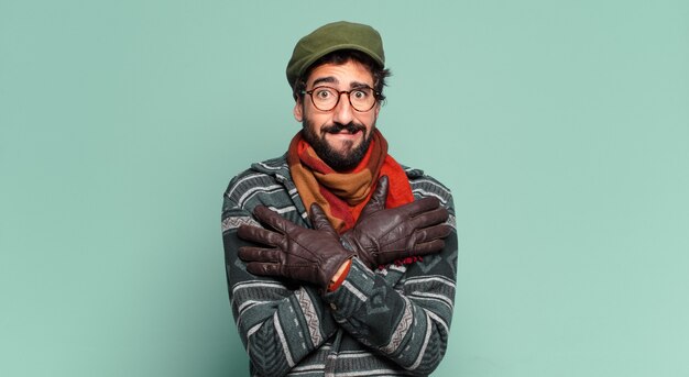 Young crazy bearded man and wearing winter clothes