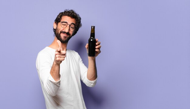 Young crazy bearded man with a beer