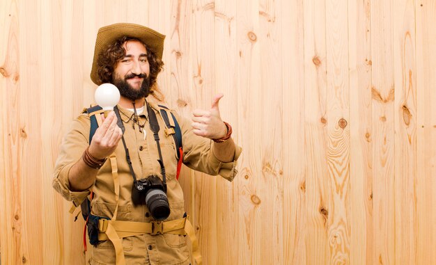 Young crazy explorer with straw hat and backpack