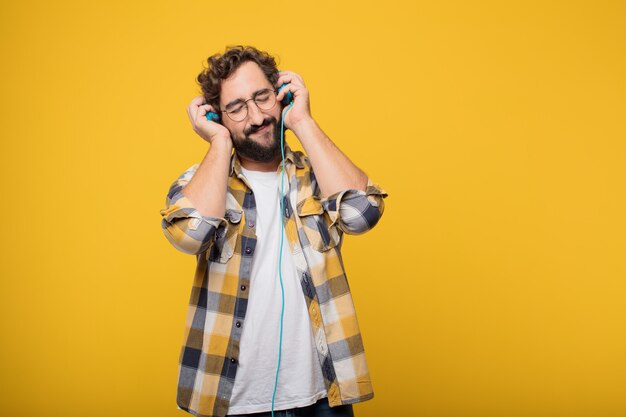 Young crazy mad man  fool pose listening music with a headphones