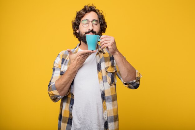 Young crazy mad man  fool pose with a coffee.