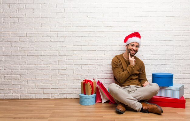 Young crazy man celebrating christmas in his house