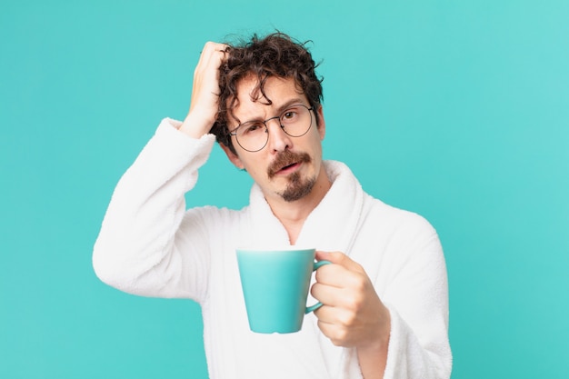 Young crazy man having a coffee