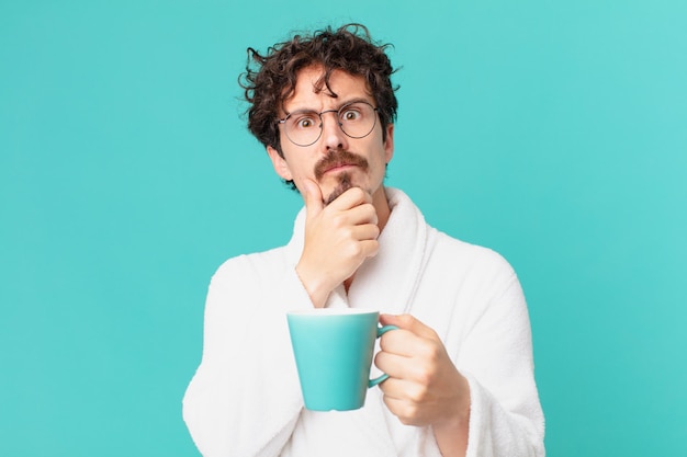 Young crazy man having a coffee