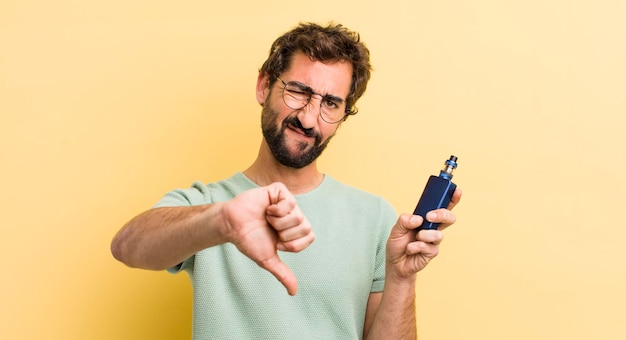 Young crazy man smoking with a vaporizer