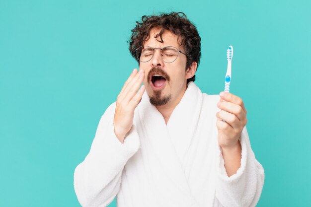 Young crazy man with a teethbrush