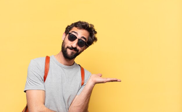 Young crazy traveler man doubting or uncertain expression