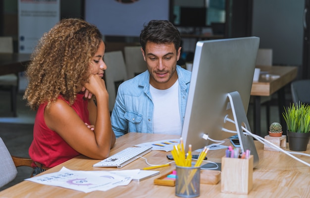 Young creative business colleagues looking analysis marketing report and chart for new startup project in workplace office