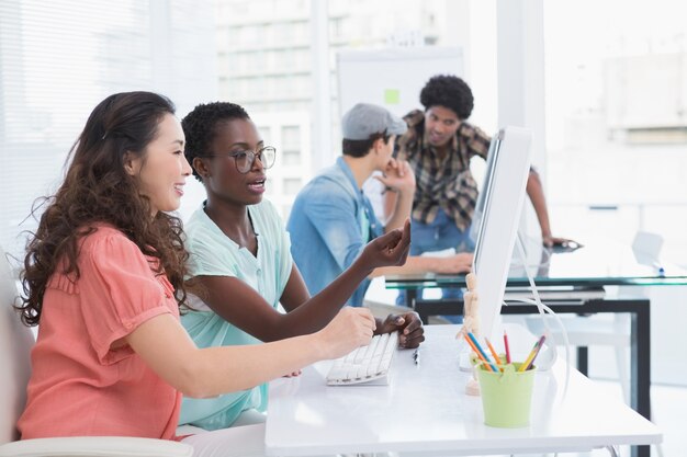 Young creative team working at desk