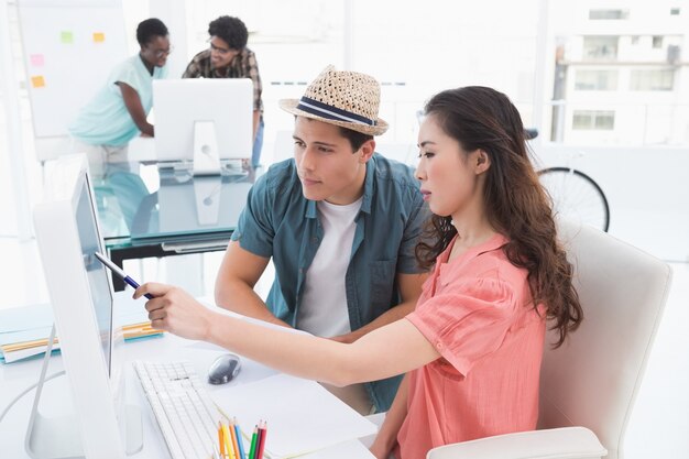 Young creative team working at desk