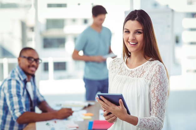 Young creative worker smiling at camera