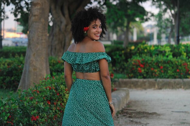 Young cuban woman in a natural park