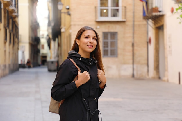 Young curious woman travelling and visiting Europe in winter time