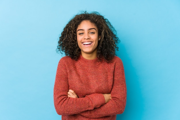 Young curly hair woman laughing and having fun