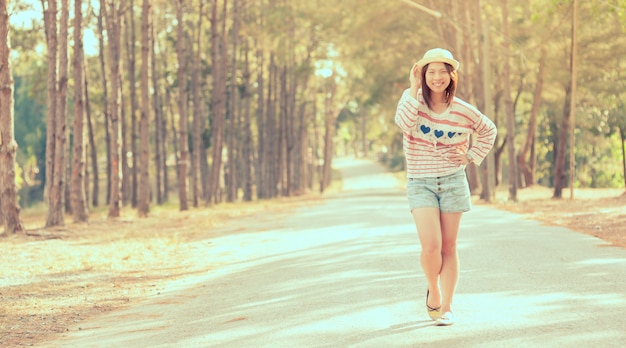 Young cute girl vintage style on country road