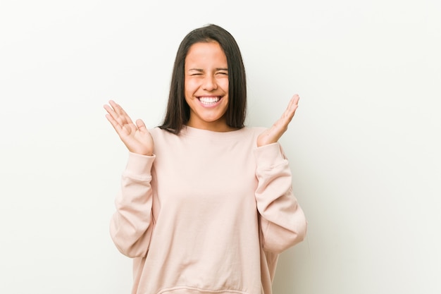 Young cute hispanic teenager woman joyful laughing a lot. Happiness concept.