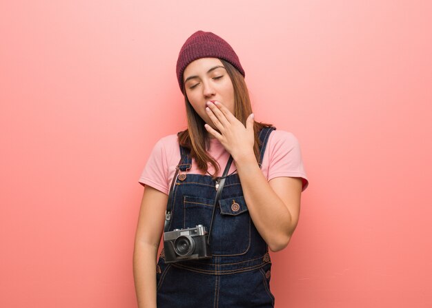 Young cute photographer woman tired and very sleepy