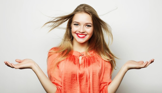 Photo young cute smiling blond girl on white background