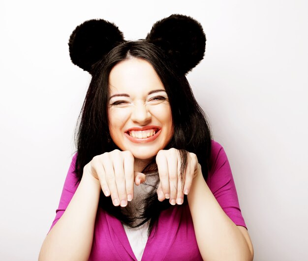 Young cute smiling brunette girl over white background