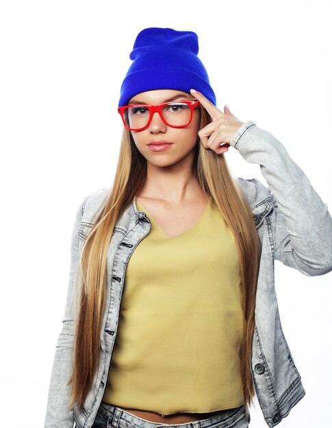 Young cute smiling  hipster girl on white background