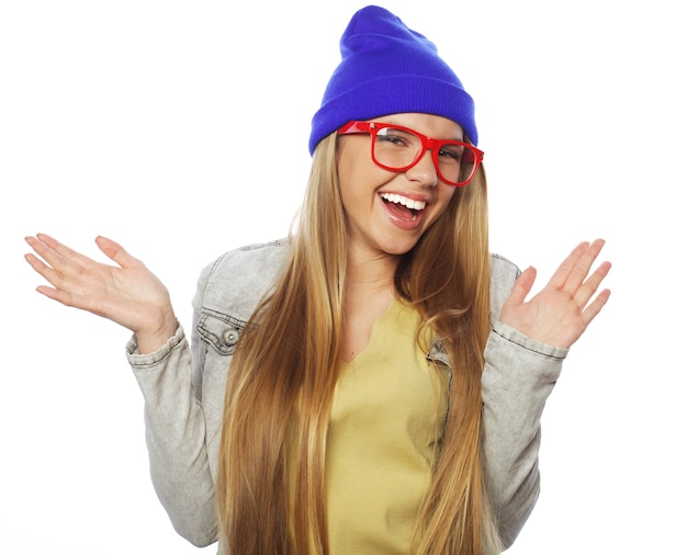 Young cute smiling hipster girl on white background