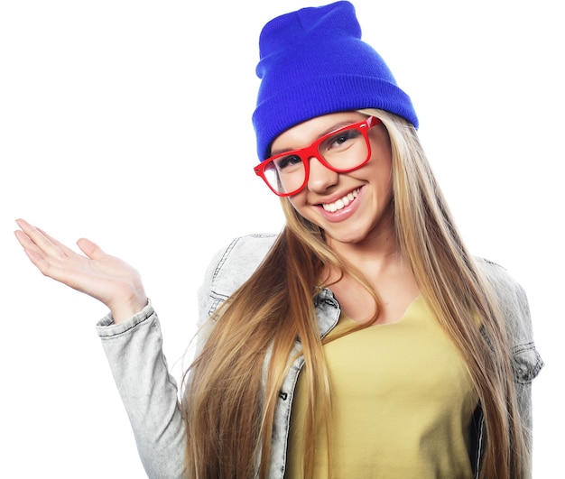 Young cute smiling hipster girl on white background