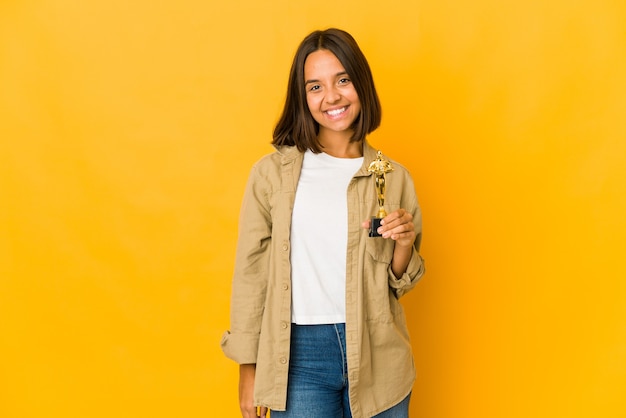 Young cute woman holding an award