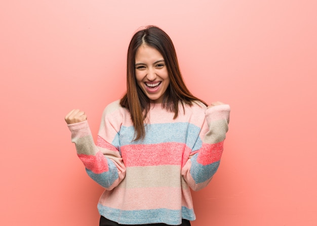 Young cute woman surprised and shocked