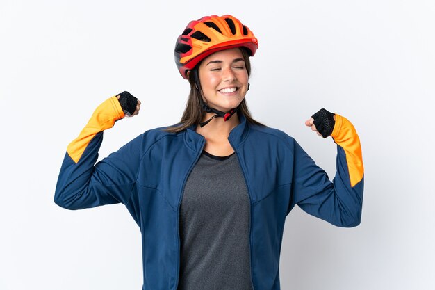 Young cyclist brazilian girl isolated on white  doing strong gesture