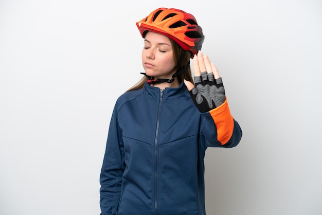 Young cyclist Lithuanian woman isolated on white background making stop gesture and disappointed