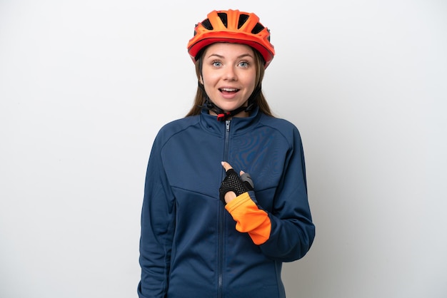 Young cyclist Lithuanian woman isolated on white background with surprise facial expression