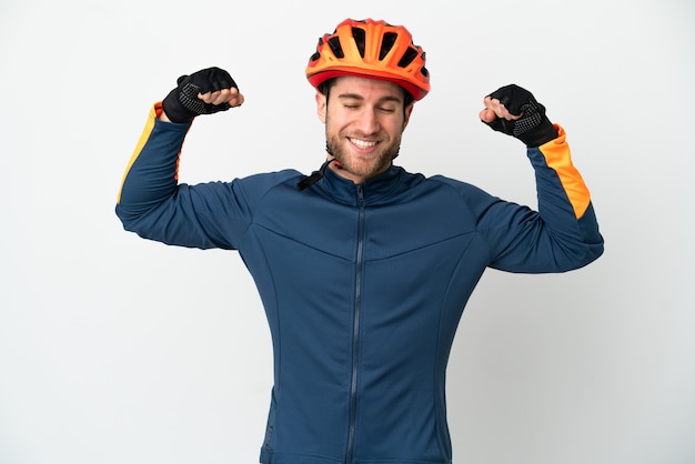 Young cyclist man isolated on white background doing strong gesture