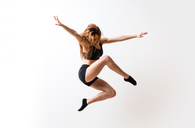 Young dance girl  isolated white wall