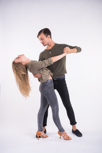 Young dancers on white background