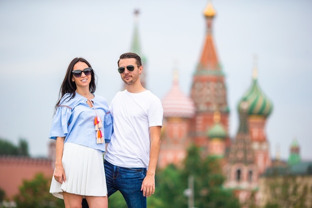 Young dating couple in love walking in city background st basils church