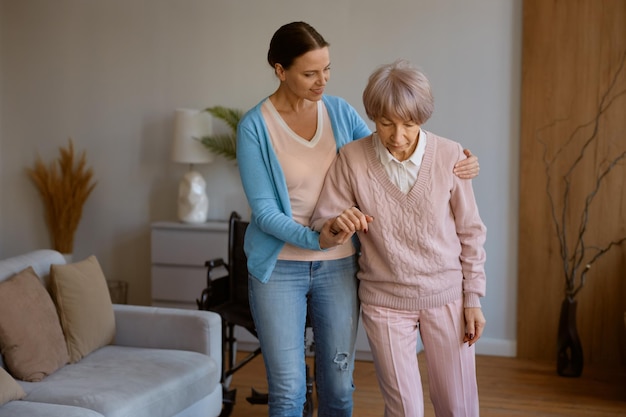 Young daughter caring for retired mom with physical or mental disorder